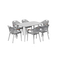 Moderne grijze kunststof eettafel met zes stoelen met gatenpatroon